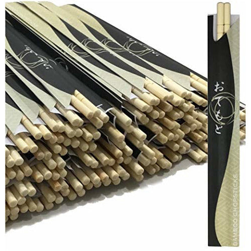 Bundle of disposable bamboo chopsticks alongside a reusable pair