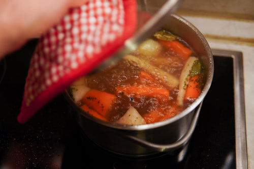 A pot of soup simmering on the hob during a Sunday cook