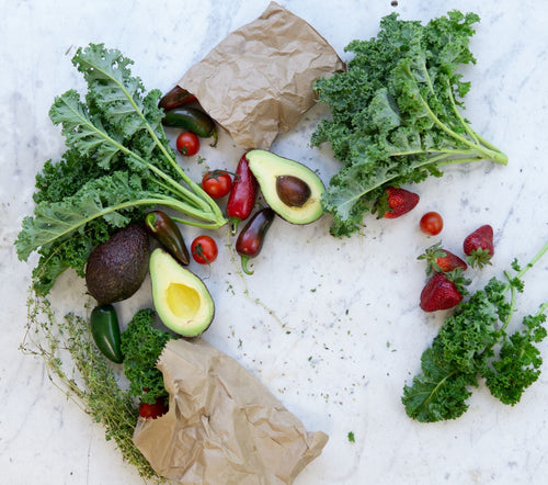 Fresh vegetables and fruit laid out, the ingredients of a regular weeknight rotation