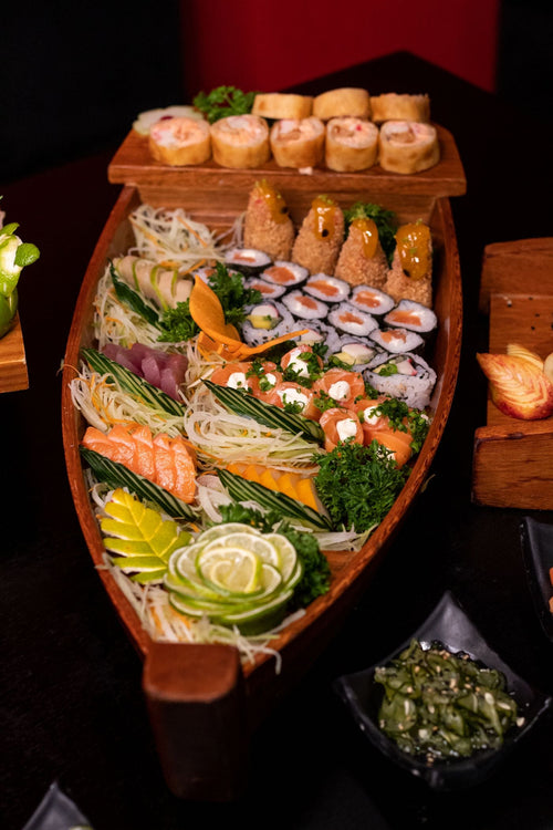 Sushi platter with an assortment of rolls, nigiri and sashimi