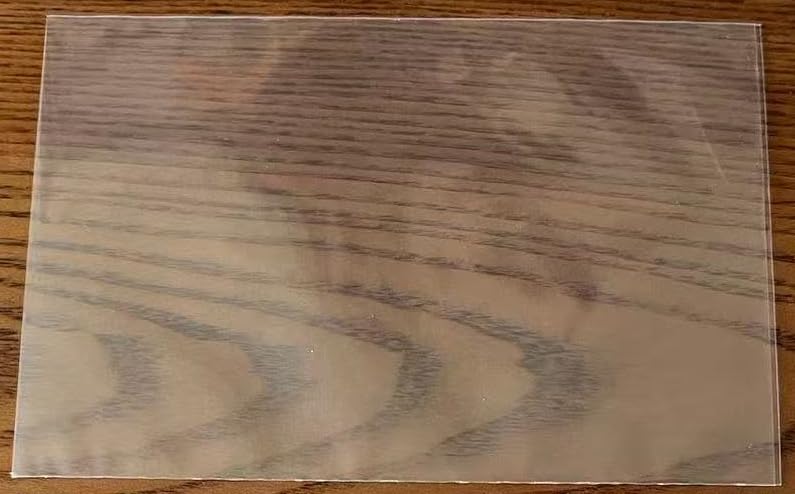 Close up of one clear 4x6 recipe card sleeve on a wooden table