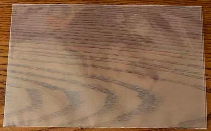 Close up of one clear 4x6 recipe card sleeve on a wooden table