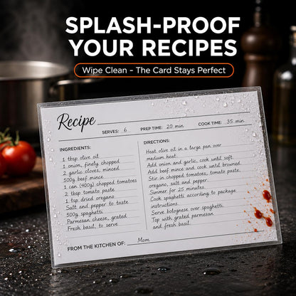 Sleeved recipe card propped by the stove, wiped clean of splashes