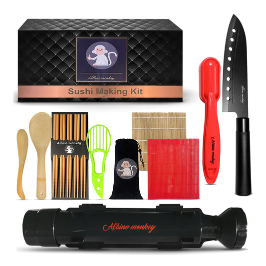 Albino Monkey 20-piece sushi making kit laid out on white: sushi bazooka roller, sashimi knife, bamboo rolling mat, dishwasher-safe mat, nigiri mold, avocado slicer, rice paddle, spreader, 10 bamboo chopsticks and gift box